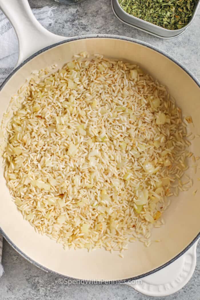 Rice, onion and garlic in a sauce pan
