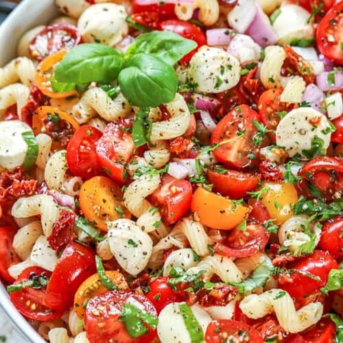 close up of bowl of Caprese Pasta Salad