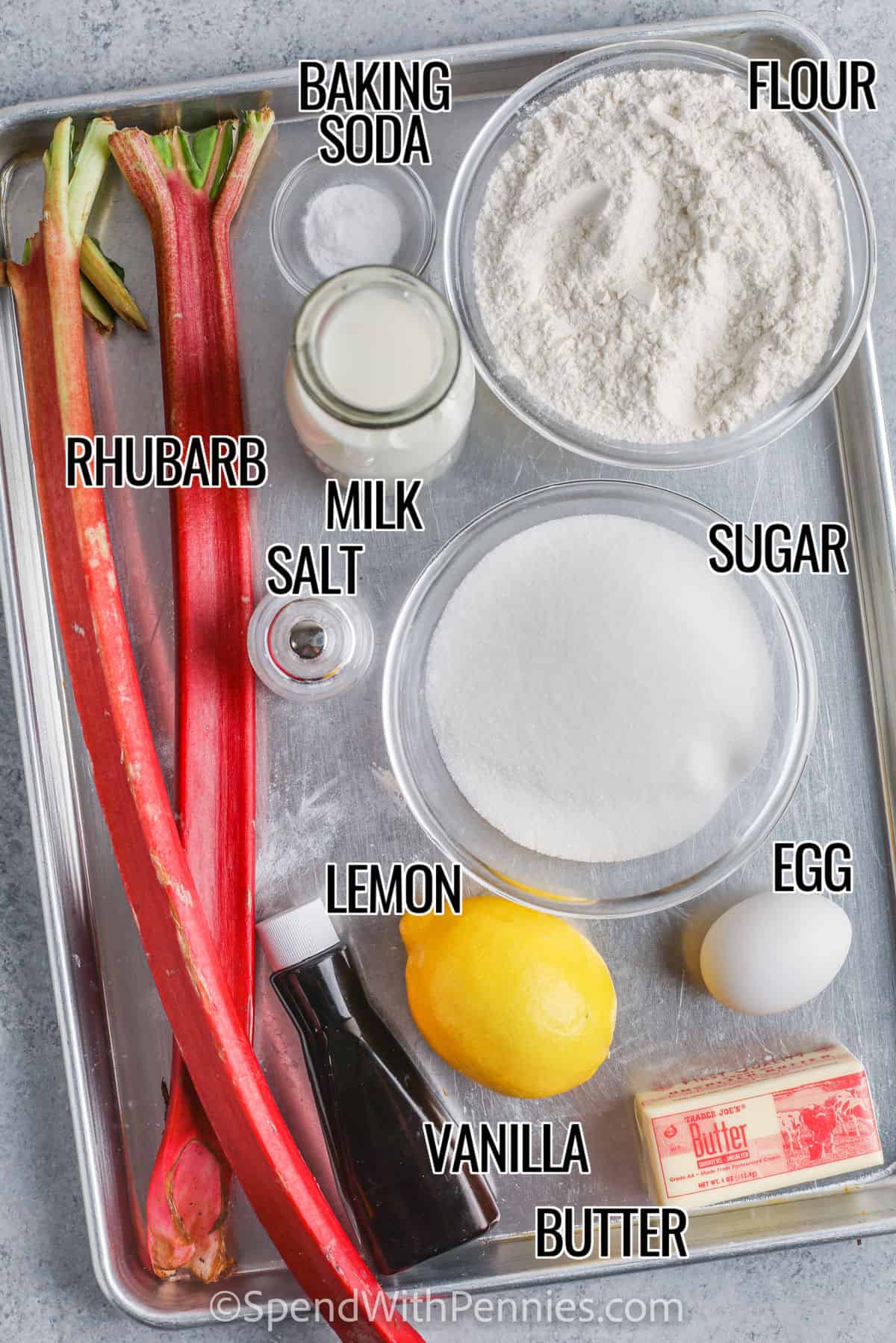 Nothing beats the sweet and sour combination in this easy-to-make rhubarb cake. In this recipe, a basic cake mix is combined with rhubarb and then topped with sugar and cinnamon. Add a dollop of whipped cream and this cake is sure to be devoured! #rhubarbcake #easyrhubarbcake #dessert #spendwithpennies Rhubarb Cake ingredients with labels