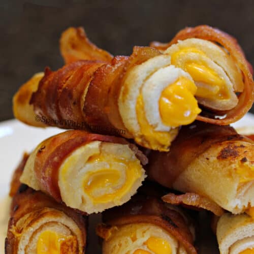 cooked Crispy Bacon Grilled Cheese Roll Ups on a plate