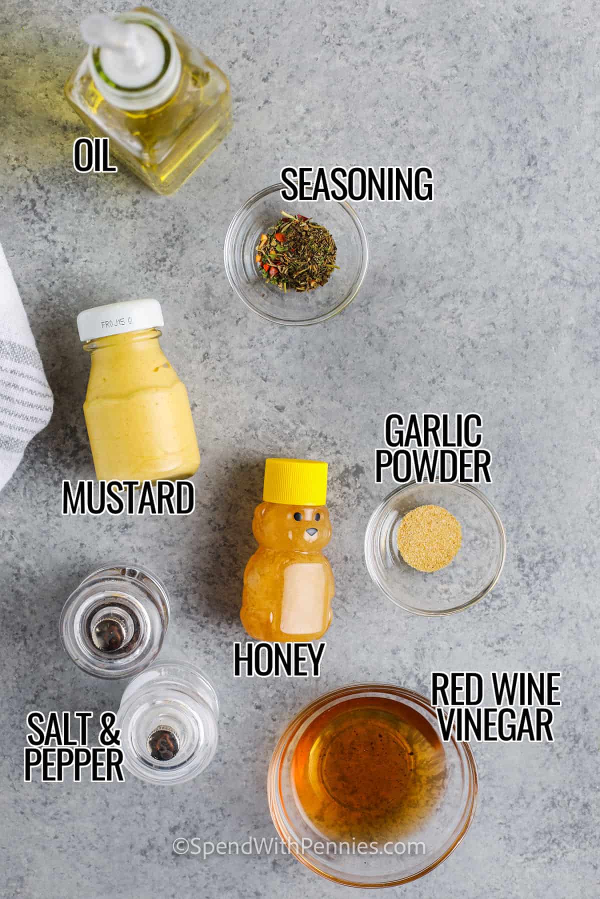 seasoning , red wine vinegar , honey , mustard and oil to make Italian Dressing with labels