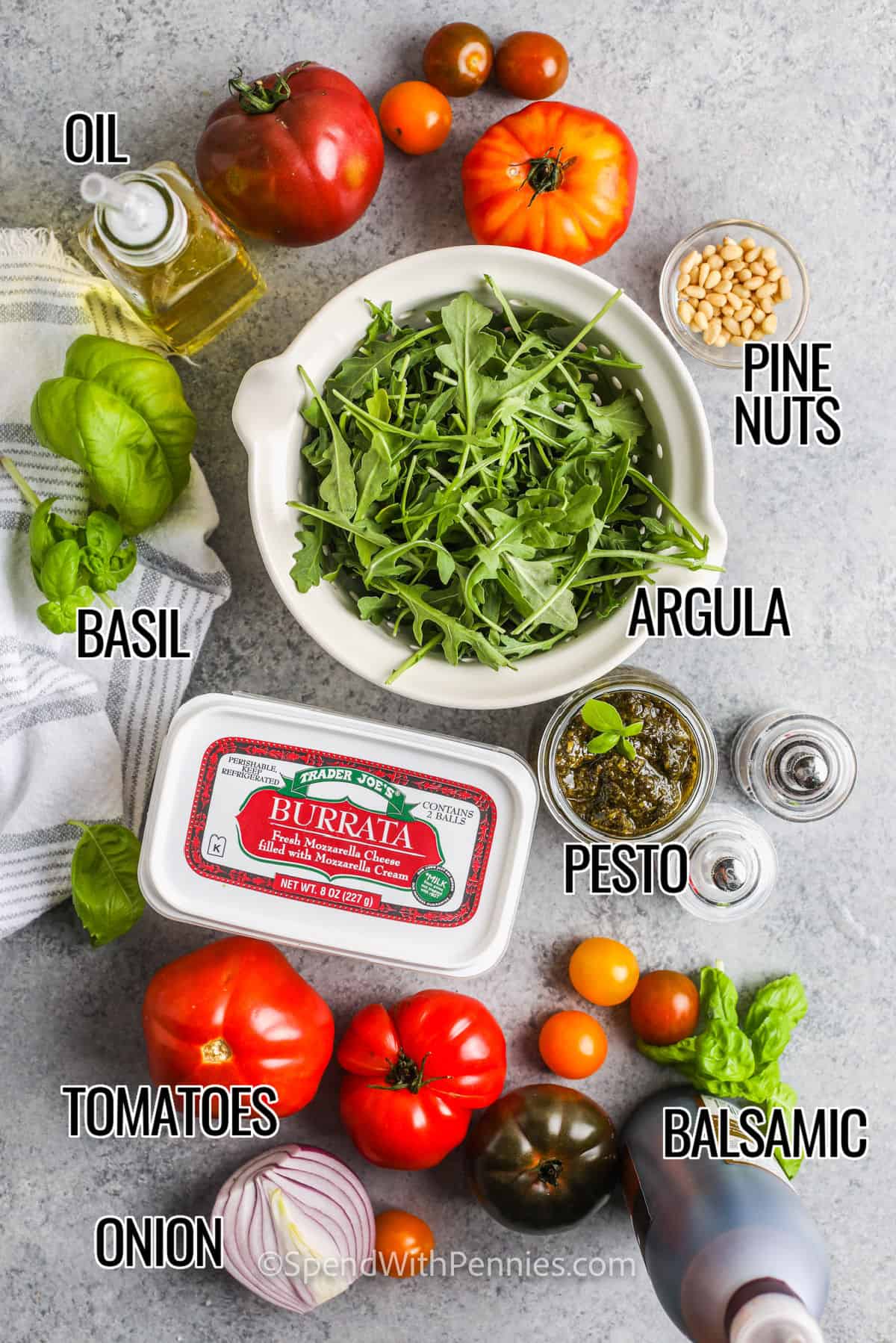 argula , pesto , balsamic , pine nuts and oil to make Tomato Burrata Salad with labels