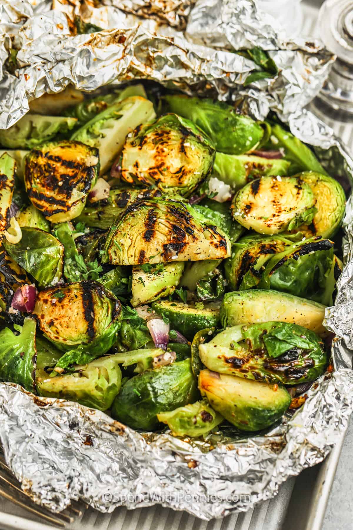 cooked Grilled Brussel Sprouts in a tin foil packet