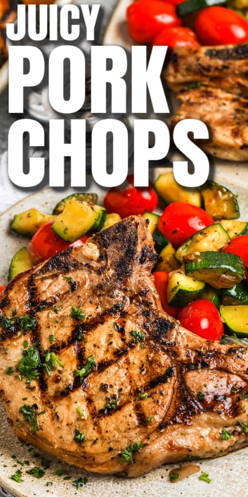 Make this delish recipe for thick and juicy grilled pork chops with a flavorful marinade recipe. It doesn't take long to cook this easy entree on the gas grill. Use boneless or bone-in loin chops and serve with tasty side dishes and a salad for the best summertime meal ever! #grilledporkchops #boneless #bestgrilledporkchopsrecipe #spendwithpennies plated Grilled Pork Chops with a title