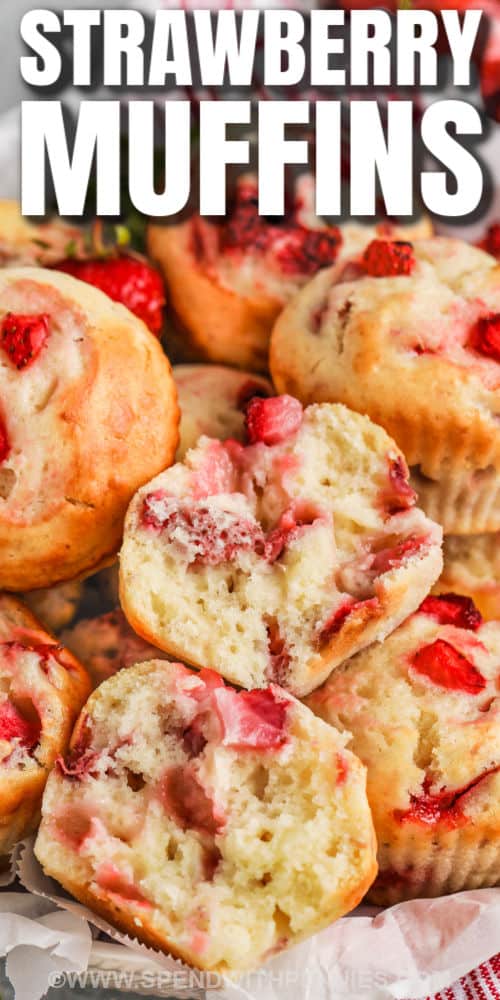 It will be hard to resist these simple and sweet strawberry muffins. It is so easy to make a homemade batch of muffins from scratch. For this recipe add fresh or frozen strawberries, some sour cream, and butter, plus cinnamon for a burst of flavors. It's a simple and delicious recipe that can be served for breakfast or dessert. #strawberrymuffins #easyrecipes #strawberrymuffinrecipe #spendwithpennies bowl of Strawberry Muffins with one in half with a title