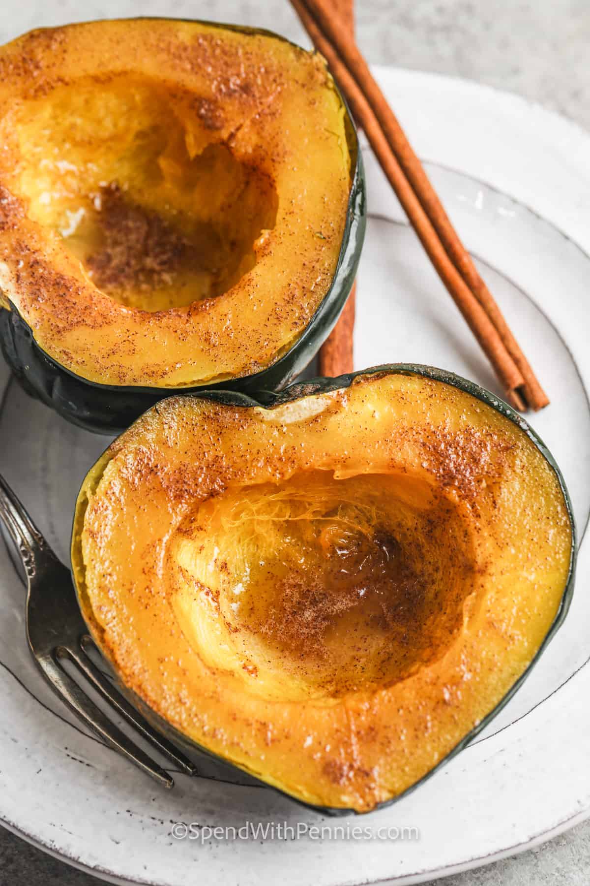 plated Microwave Acorn Squash with a cinnamon stick