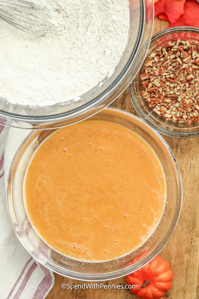 ingredients for pumpkin bread mixed in a bowl
