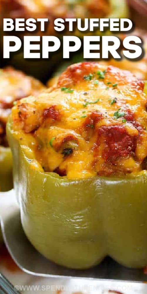 Using the pepper itself as a serving vessel, we've filled these Stuffed Peppers with a delicious beef, sausage and rice filling perfect for a quick and complete meal in one tidy package! Stuffed Peppers are easy to make and everyone loves them! We fill these with a mixture of beef and sausage but you can use one or the other (or even ground turkey if you prefer) and I sometimes replace the rice with cauliflower rice. #spendwithpennies #stuffedpeppers #easy #recipe cooked Easy Stuffed Peppers with writing