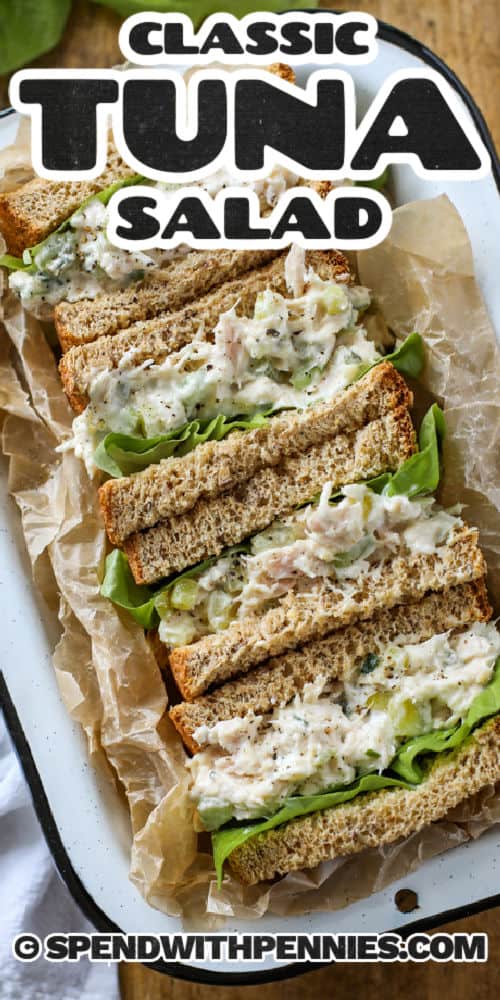 Make this easy tuna salad for a light sandwich or snack. It is packed with budget-friendly ingredients, loads of protein make it nutritious and delicious. Make it ahead of time and serve it cold. This salad is the best! #spendwithpennies #tuna #tunasalad #tunasaladsandwiches Tuna Salad sandwiches on a plate with writing