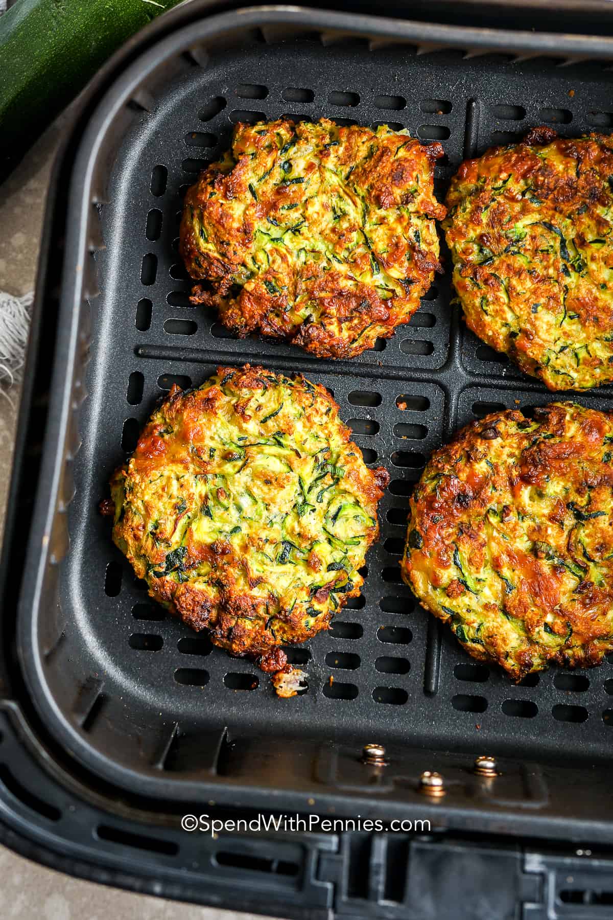 zucchini fritter patties in an air fryer