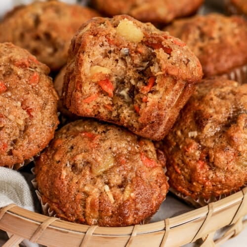 morning glory muffins in a basket lined with a towel