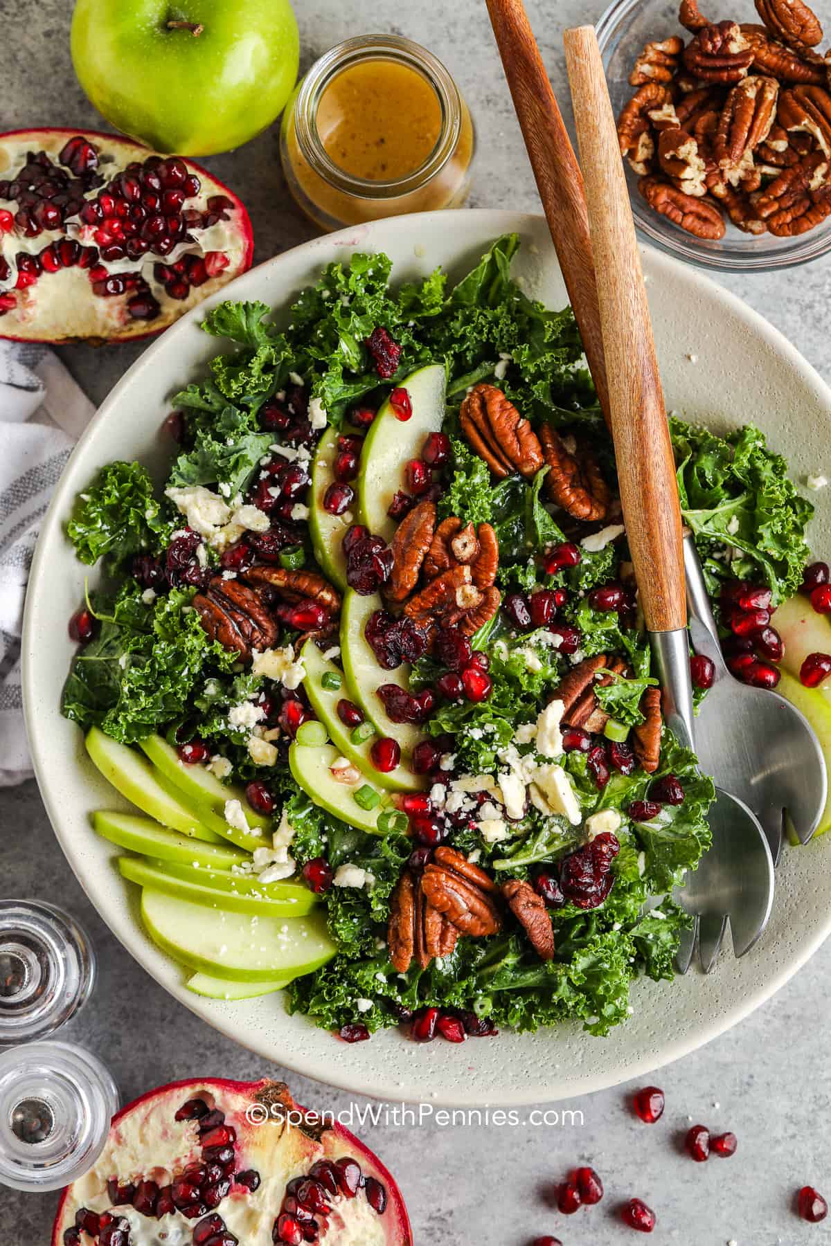 This pomegranate salad is loaded with healthy and colorful fruits and vegetables and dressed in a tangy dijon vinaigrette. There are so many options for add-ins, or just follow the recipe as is for a beautiful, crunchy, and flavorful side dish that is sure to impress! #pomegranatesalad #homemade #pomegranatesaladdressing #spendwithpennies top view of Pomegranate Salad