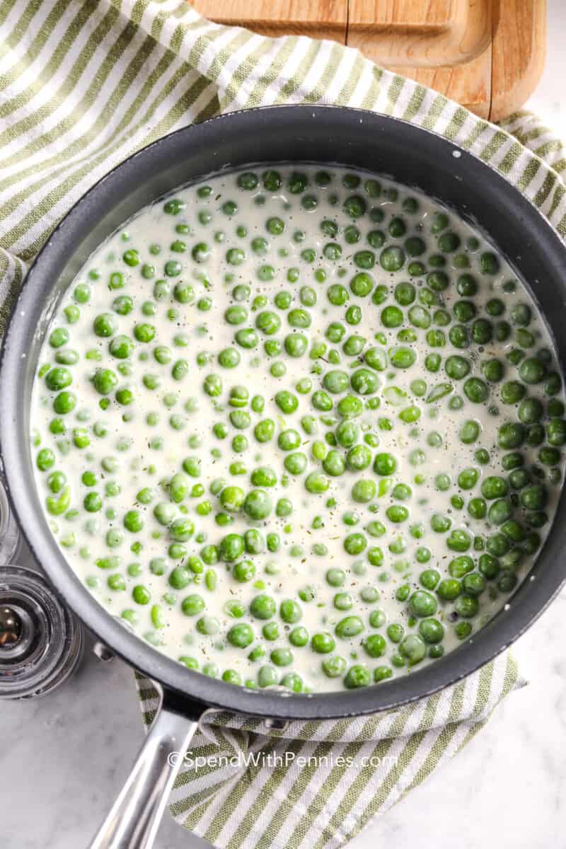 a saucepan filled with creamed peas