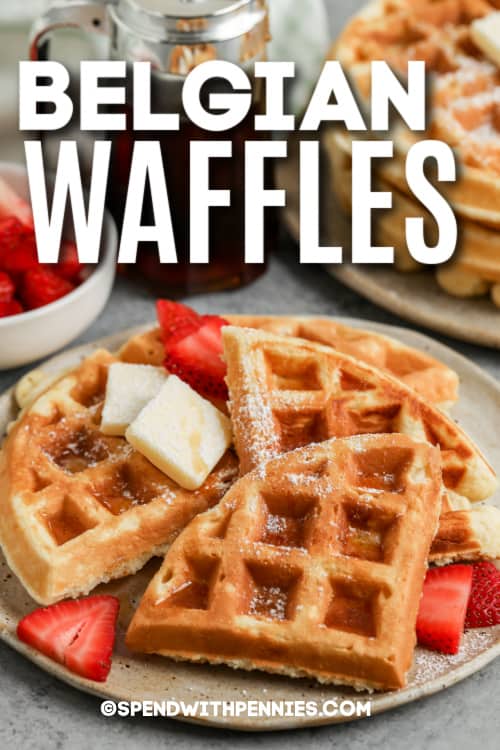 This Belgian waffle recipe is easy enough for every day but is always a welcome treat for Sunday brunch or even as a dessert! Buttermilk and whipped egg whites make these waffles extra light and crispy, while egg yolks, melted butter, and a touch of sugar and vanilla give them a fragrant fluffy richness. Drenched in syrup or your favorite sweet toppings, waffles will brighten any morning! #easybelgianwafflerecipe #spendwithpennies #belgianwafflerecipe #bestbelgianwaffles belgian waffles on a plate with text