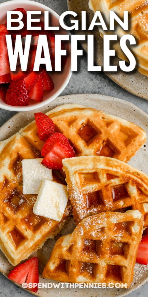 This easy, delicious Belgian waffle recipe will put a smile on everybody’s face! Buttermilk, egg yolks, melted butter, and whipped egg whites are the secret to making the lightest, crispiest, and fluffiest waffles ever! A hint of sugar and vanilla delivers the right touch of sweet, fragrant flavor. Make extras for the freezer, and you’ll have a quick breakfast, snack, or even dessert anytime! #easybelgianwafflerecipe #spendwithpennies #belgianwafflerecipe #bestbelgianwaffles top view of belgian waffles with text