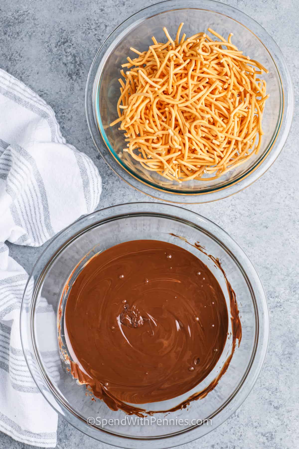 melted chocolate and butterscotch chops and chow mien noodles in bowls to make Haystacks