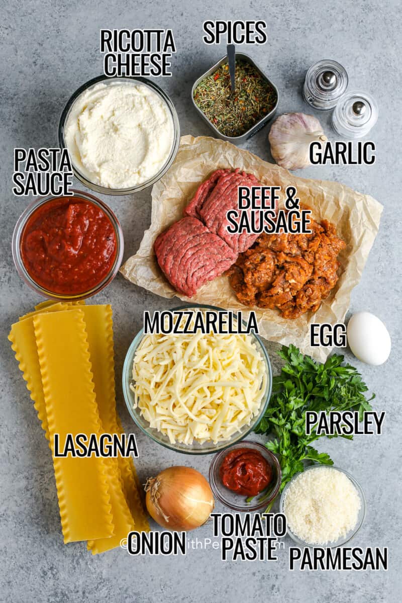 Ingredients for lasagna on a wooden board