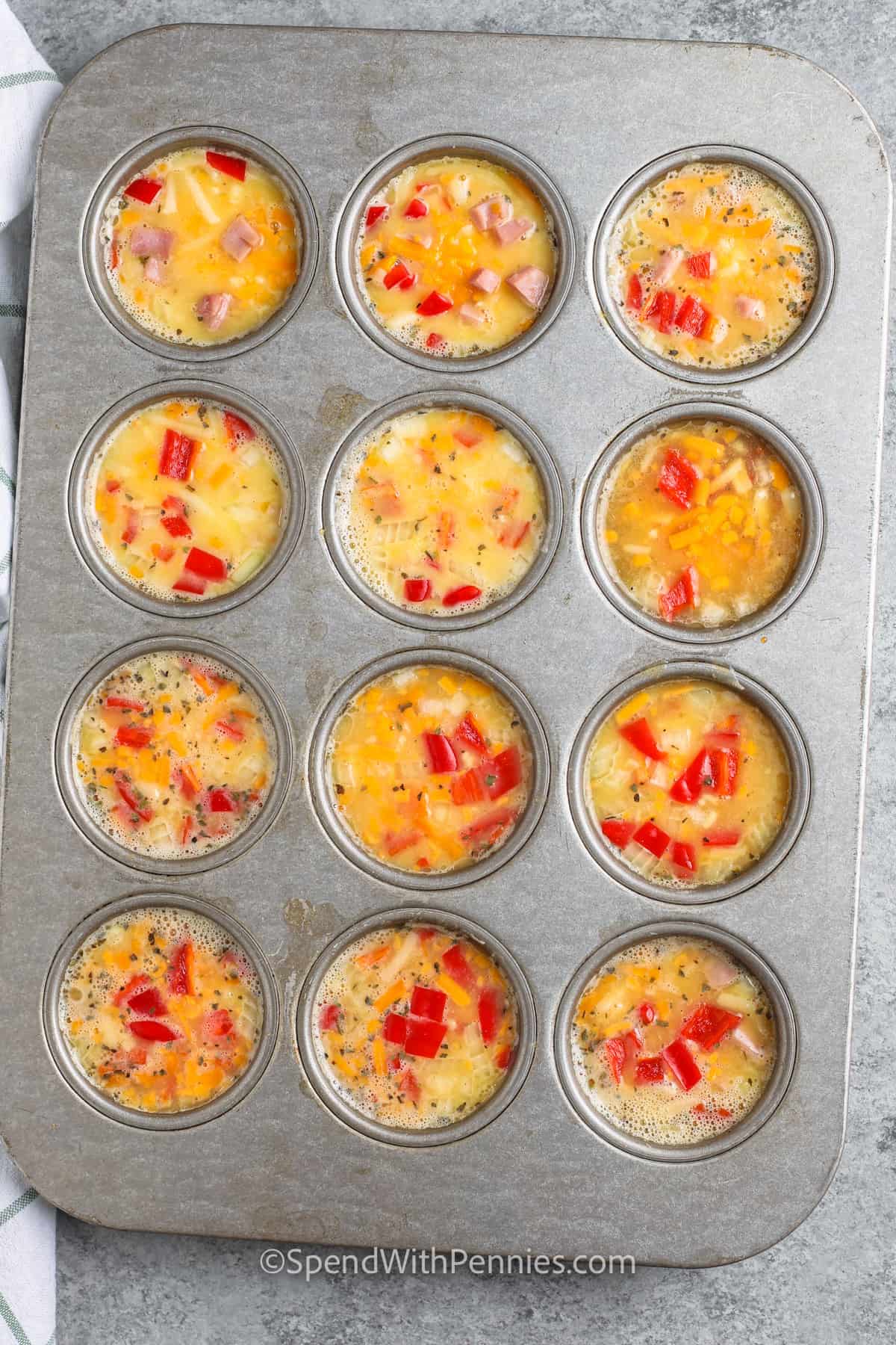 Egg Muffins are a delicious & tasty make-ahead meal. Naturally low-carb & easy to make ahead, these egg cups are perfect for an on-the-go breakfast! Add your fave meat and veggies and make them different every time! #eggmuffins #makeahead #breakfast #spendwithpennies Make Ahead Egg Muffins before cooking