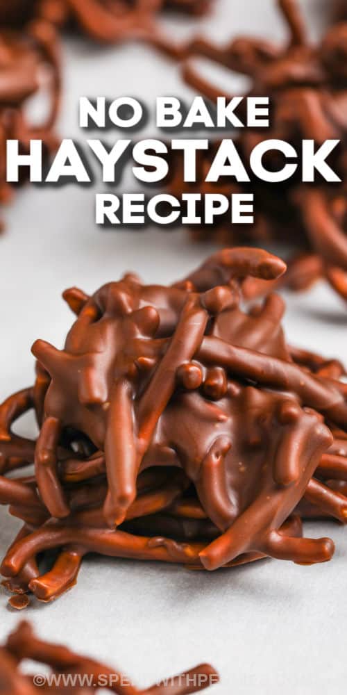 A haystacks recipe is a must-have for kids around the holidays or any time of the year. It's super fun and easy to make this crunchy treat for Christmas! Crunchy haystacks are made with butterscotch, chocolate, and chow mein noodles for a crispy and sweet treat that kids and grownups both love. They are sure to become everyone's favorite cookies, and for good reason, they are so easy to make! #haystacksrecipe #butterscotchchocolate #chowmeinnoodles #spendwithpennies close up of Haystacks with writing
