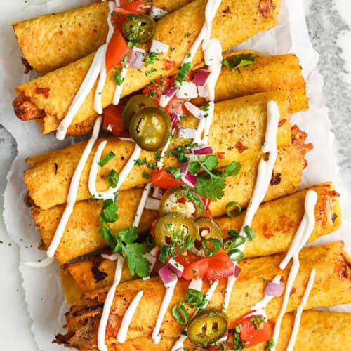 top view of Chicken Taquitos with sour cream