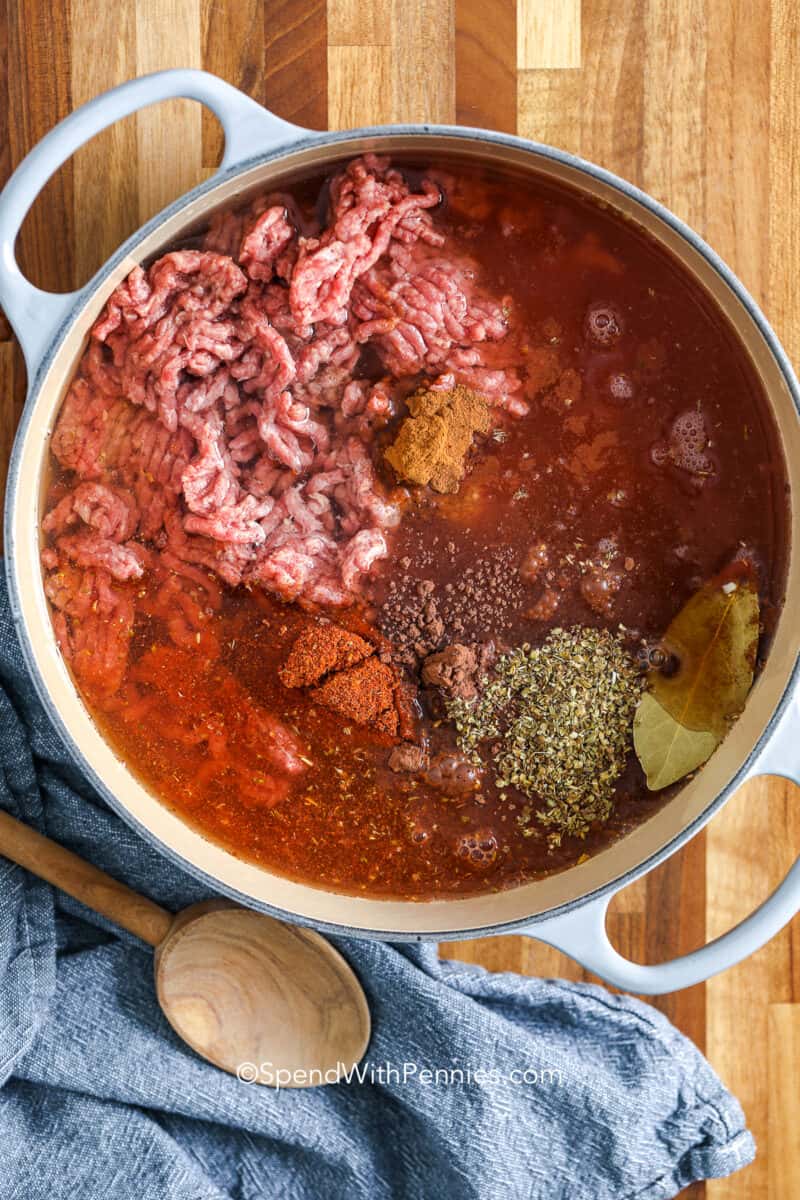 water added to uncooked ingredients for cincinnati chili in a dutch oven