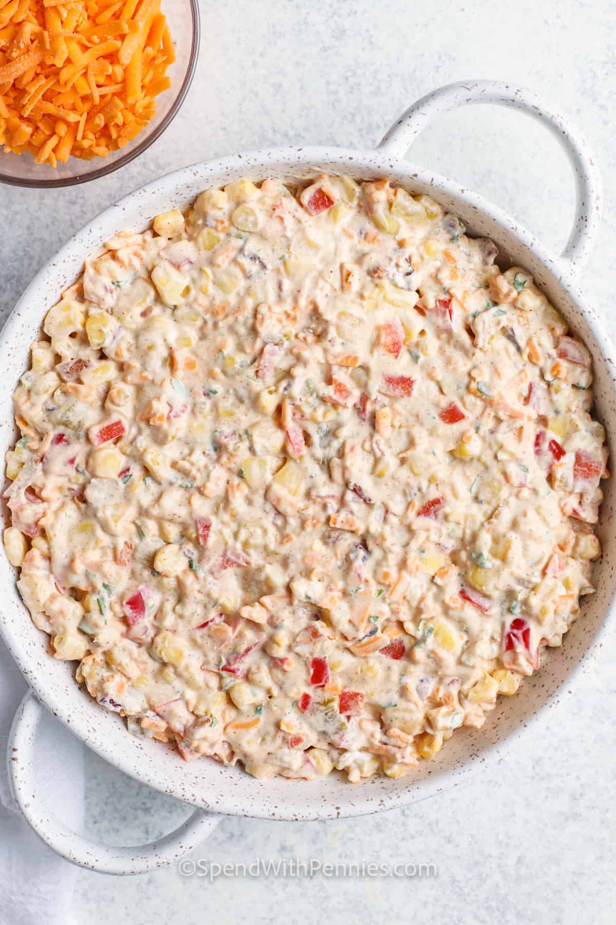 Creamy Baked Corn Dip in the dish before adding cheese