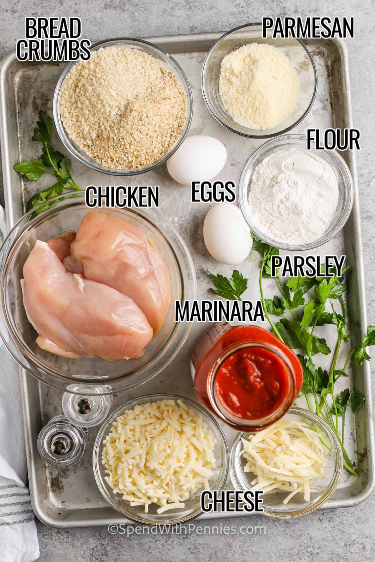 bread crumbs , parmesan , flour , eggs , chicken , marinara sauce , parsley and cheese with labels to make Easy Chicken Parmesan