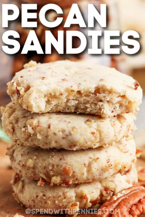 This easy recipe for homemade pecan Sandies is light and buttery, and super simple. Everyone loves old-fashioned pecan sandies! #pecansandies #cookies #recipe #homemade #spendwithpennies pile of Pecan Sandies with a title