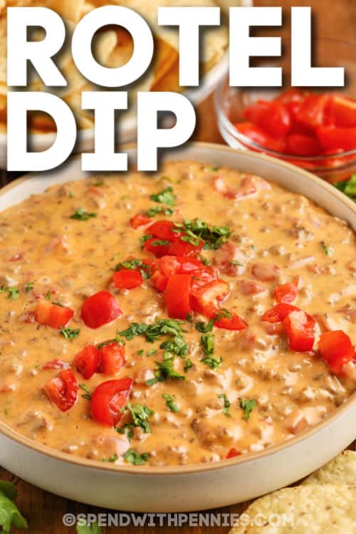 Rotel dip needs just four simple ingredients; ground beef or sausage, tomatoes, chili powder, and cheese! Ready in 20 minutes, it is an easy and delicious dip that is the perfect addition to any party spread! #roteldip #velveetadip #groundbeefdip #spendwithpennies Rotel Dip with peppers and chips with a title