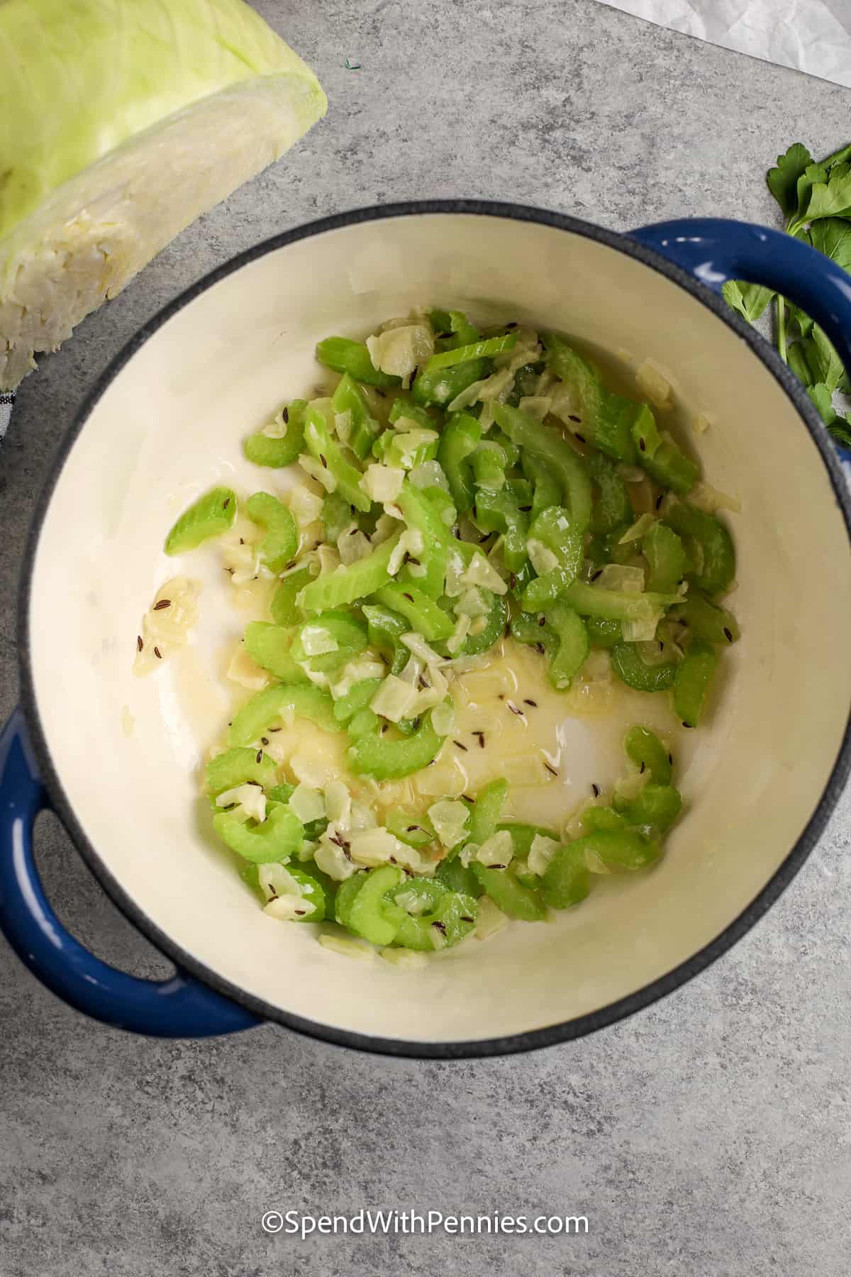 onion and celery cooking in a pot