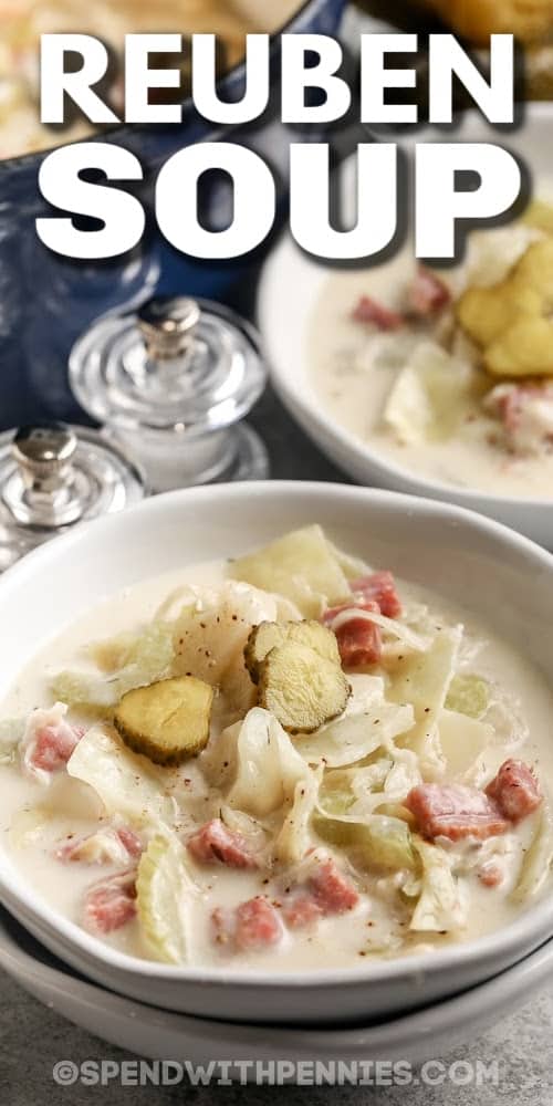 If you like a good Reuben sandwich, then you’ll love this delicious recipe for Reuben soup! It’s the perfect meal in a bowl for chilly winter days. Shredded cabbage, corned beef, and sauerkraut are cooked with caraway seeds, mustard, and other seasonings in a creamy broth. Grated Swiss cheese is swirled in at the end. This hearty soup goes great with rye or pumpernickel croutons. Toss in potatoes or tomatoes for more flavor! #reubensoup #spendwithpennies #reubensouwithcabbage #reubensouprecipe reuben soup with text
