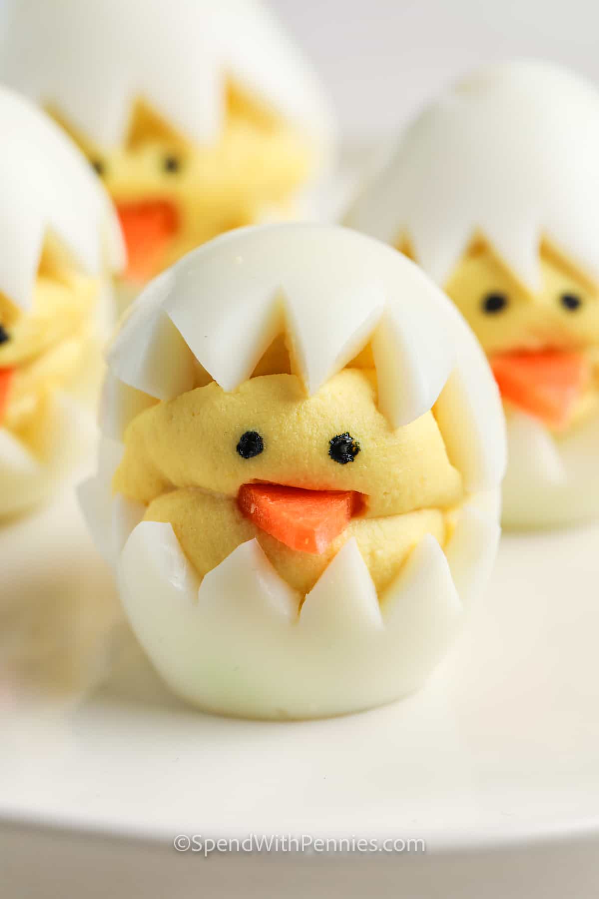 Deviled Egg Chicks are the best thing about Easter! The whole family will love making these cute little festive eggs, and they’re perfect for bringing to an Easter celebration. #deviledeggchicks #deviledeggs #easter #spring #spendwithpennies close up of Deviled Egg Chicks