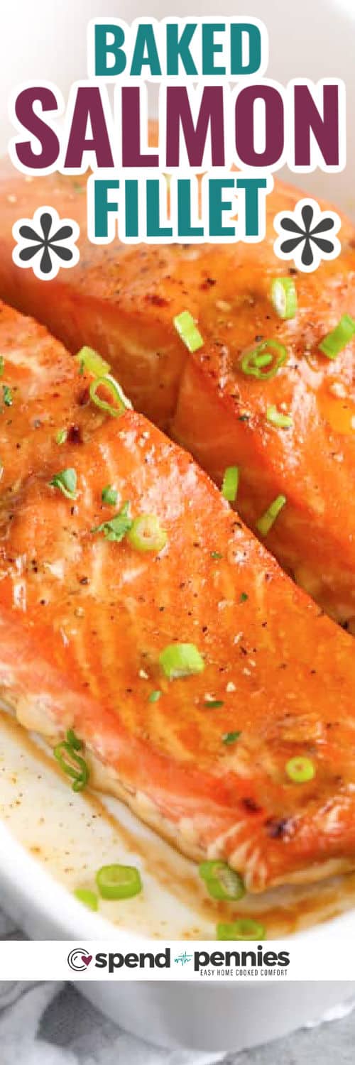 Baked salmon marinated in a ginger-orange glaze is a healthy & flavorful entree the whole family will love. Ready in only 40 minutes start to finish, it’s perfect for a quick weekday meal! #bakedsalmon #salmonmarinade #easyrecipe #spendwithpennies close up of Baked Salmon Fillets with writing
