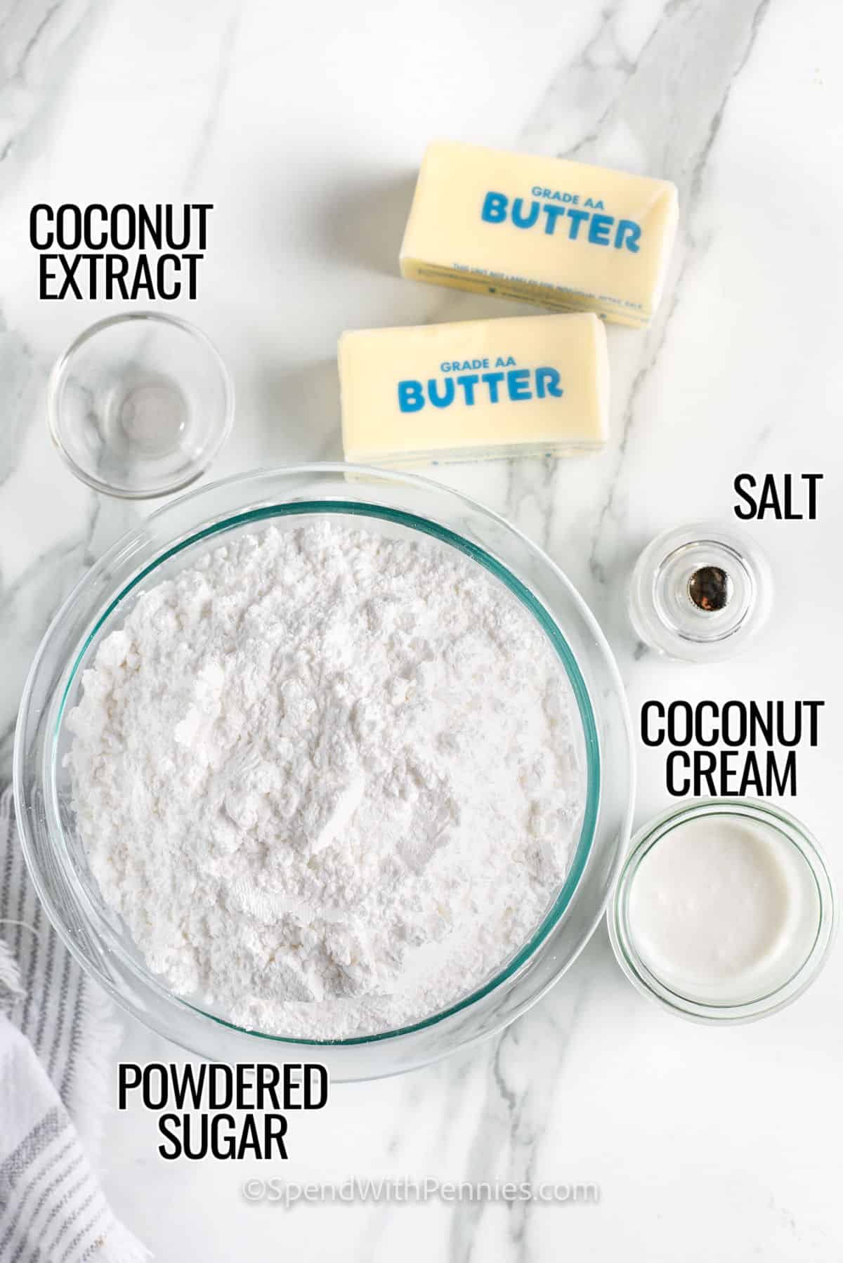 If you can make classic buttercream frosting, then this recipe for creamy coconut frosting will be a breeze! It’s just as quick and easy. Powdered sugar, coconut cream, and coconut flavoring are folded into whipped butter, and it’s done. Stir in some shredded coconut and use it to coat a German chocolate layer cake, with crumbled pecans on top. Or, pipe it in fluffy swirls on cupcakes. #coconutfrosting #spendwithpennies #coconutfrostingrecipe #coconutfrostingeasy powdered sugar , coconut cream , coconut extract , salt and butter with labels to make Coconut Frosting
