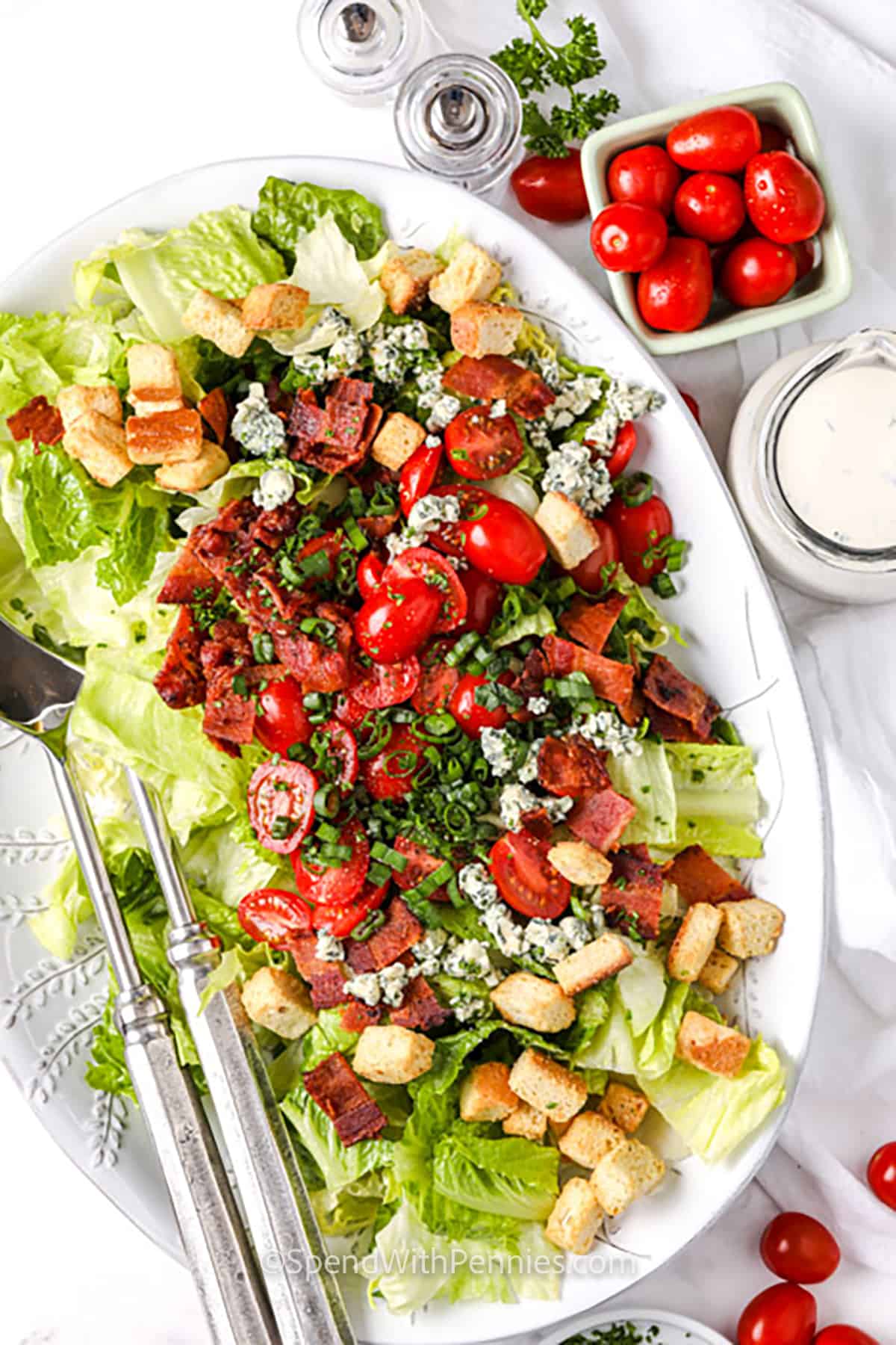 If you're looking for a quick and easy lunch or side dish for a picnic, BLT salad is a great choice. It's easy to make and gives you a delicious mix of veggies and protein that will leave you feeling full. #bltsalad #blt #salad #recipe #spendwithpennies BLT salad in a bowl