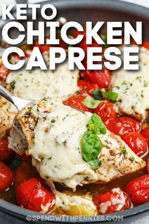 keto easy chicken caprese in a skillet with cheese, basil, and cherry tomatoes with writing