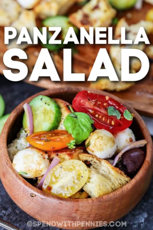 Panzanella Salad recipe is a lovely bread salad full of full of fresh herbs! The tangy and light flavors of tomatoes, cucumbers, mozzarella and toasted ciabatta pieces are perfect for a hot summer day. #panzanellasalad #salad #sidedish #summersalad #spendwithpennies bowl of Easy Panzanella Salad with writing