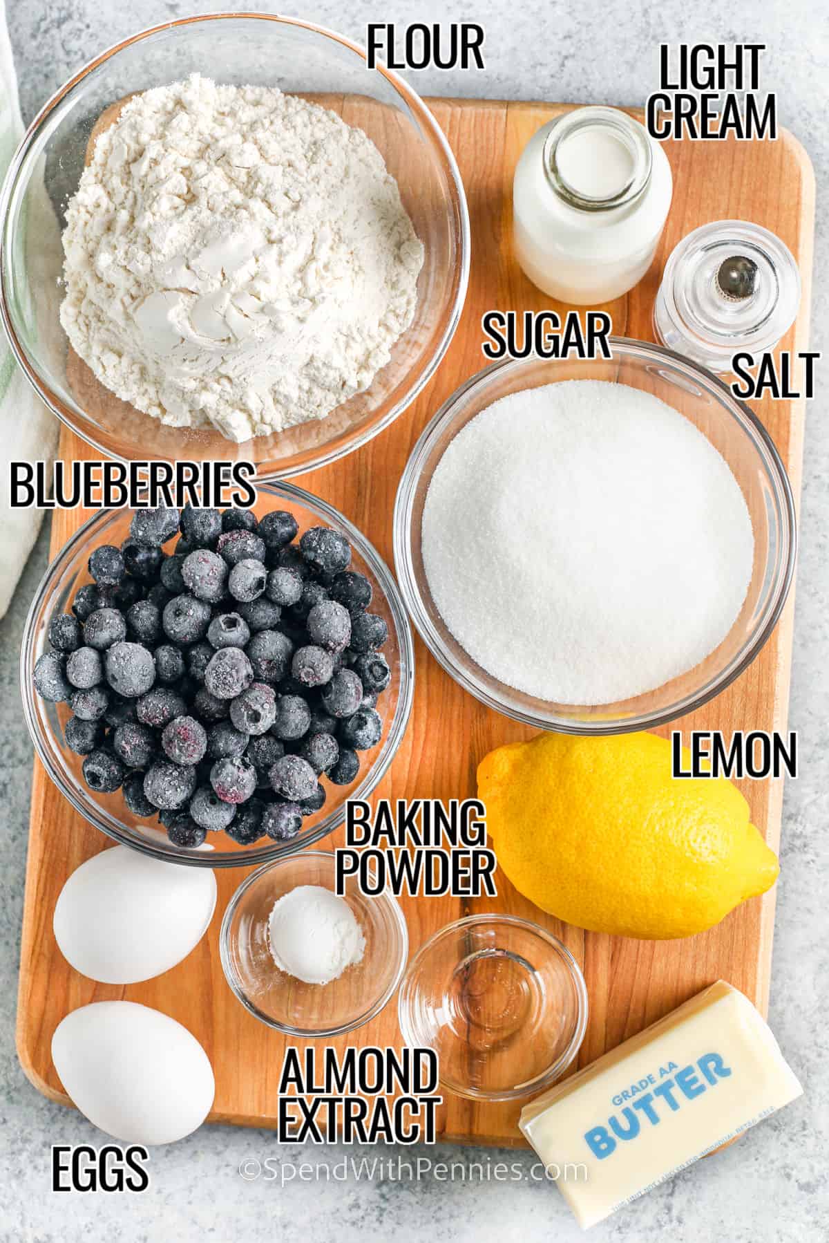 Make this easy blueberry bread recipe for the best morning treat. It's simple to make this recipe into blueberry muffins too. Add some sour cream along with the lemon juice for even more tang. Moist, delicious, and quick to mix up, this is one recipe for blueberry bread that that chef will want to bake again and again. #blueberrybreadrecipe #easyblueberrybread #bestblueberrybread #spendwithpennies flour , sugar , light cream , salt , blueberries , baking powder , lemon , almond extract , eggs with labels to make Blueberry Bread