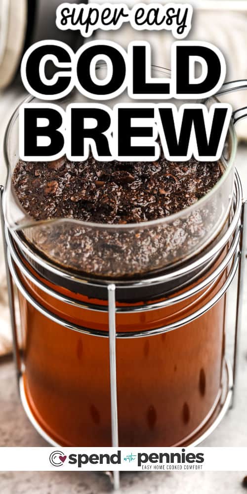 Make a Starbucks coffee cold brew at home with this easy-to-make recipe. The best summer drink that is low in calories, and with a kick of caffeine, is just at your fingertips. To make this recipe, simply allow the coffee to soak in a French press for a few hours. Add some whipped cream, vanilla, pumpkin spice, or a sweetener to add a deeper flavor to this popular summer drink. #coldbrew #coldbrewcoffee #coldbrewrecipe #spendwithpennies making Cold Brew in a french press with writing