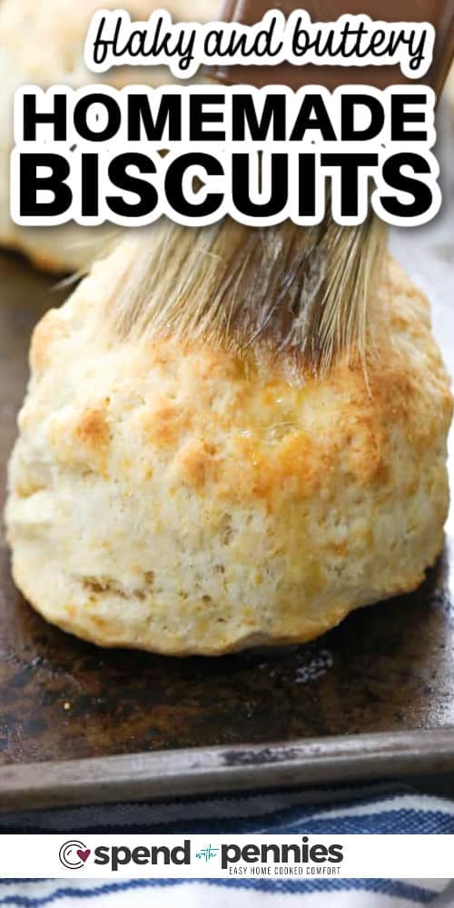 Homemade biscuits are so versatile! Serve them with jam for Sunday morning brunch, or with soup or stew for dipping! Add cheddar cheese or chocolate chips for a savory or sweet flavor. You can enjoy these tender & flaky biscuits in so many different ways. #homemadebiscuits #fromscratch #homemade #biscuits #spendwithpennies brushing butter on Homemade Biscuits with writing