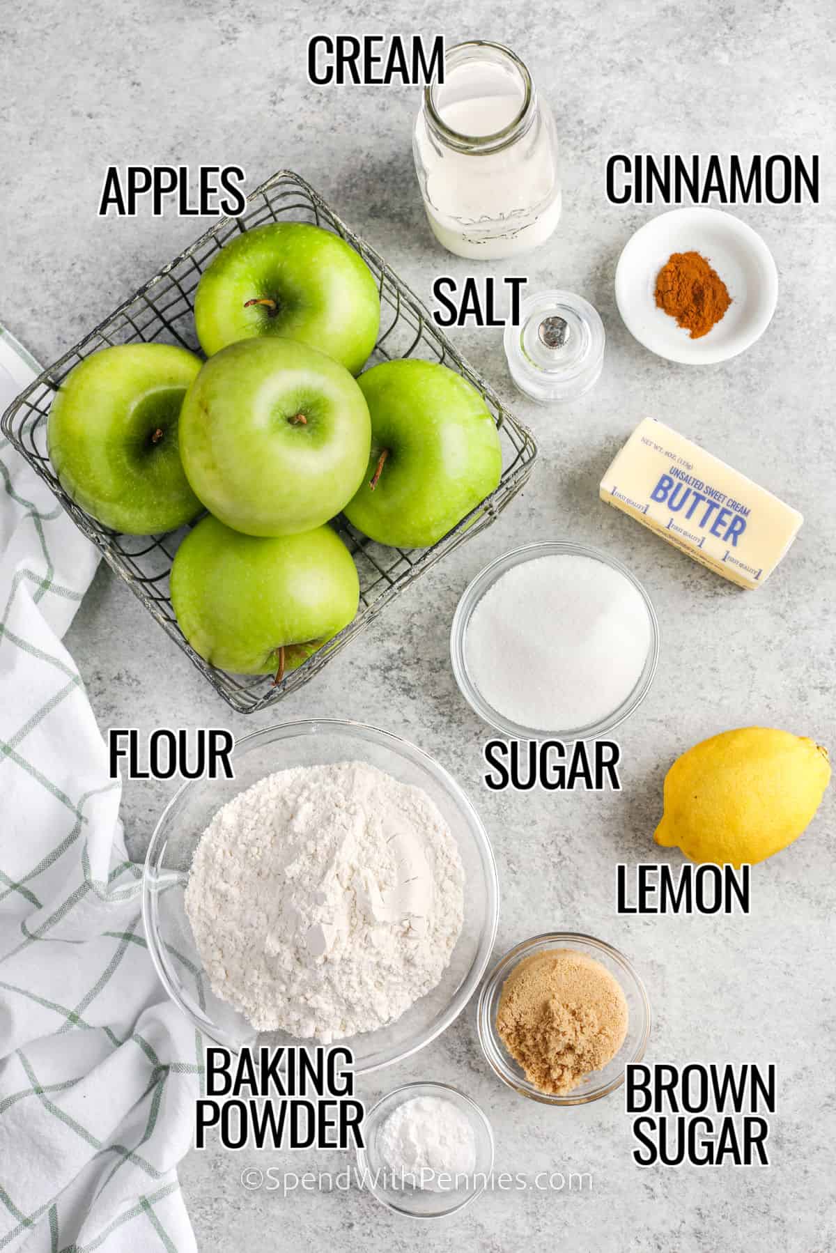 Apple cobbler is made with tart apples made into a pie filling, and sweet buttery biscuit topping for a simple and delicious dessert. This easy recipe is chock full of homemade goodness. Try it with a scoop of vanilla ice cream or some whipped cream topping. Sweet crisp goodness. #applecobbler #dessert #homemade #spendwithpennies ingredients to make an apple cobbler with labels