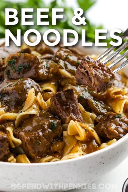 This beef and noodles recipe is a simpler, but equally delicious version of beef stroganoff! Stew beef is browned in seasoned flour, then slow cooked in the oven until fork tender, with onions, celery, and savory herbs. Transfer it to the stovetop and make a rich gravy, then serve over tender egg noodles. All you need is some steamed broccoli on the side for a delicious, comforting dinner! #beefandnoodlerecipe #beefandnoodles #recipe #spendwithpennies beef and noodles with text