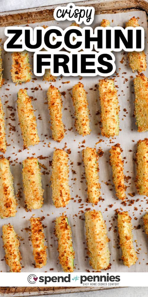 baked Crispy Zucchini Fries on a sheet pan with a title