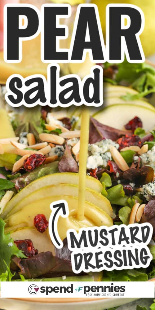 When it comes to tasty salads, try this elegant pear salad recipe. It's simple to make and loaded with healthy ingredients. It can be customized with different ingredients like pomegranate, arugula, or cheese like gorgonzola, feta, or goat cheese instead of blue cheese. There are so many delicious options for this homemade gourmet salad. #pearsalad #pearsaladrecipe #bestpearsaladrecipe #spendwithpennies Dressing being poured onto pear salad with text