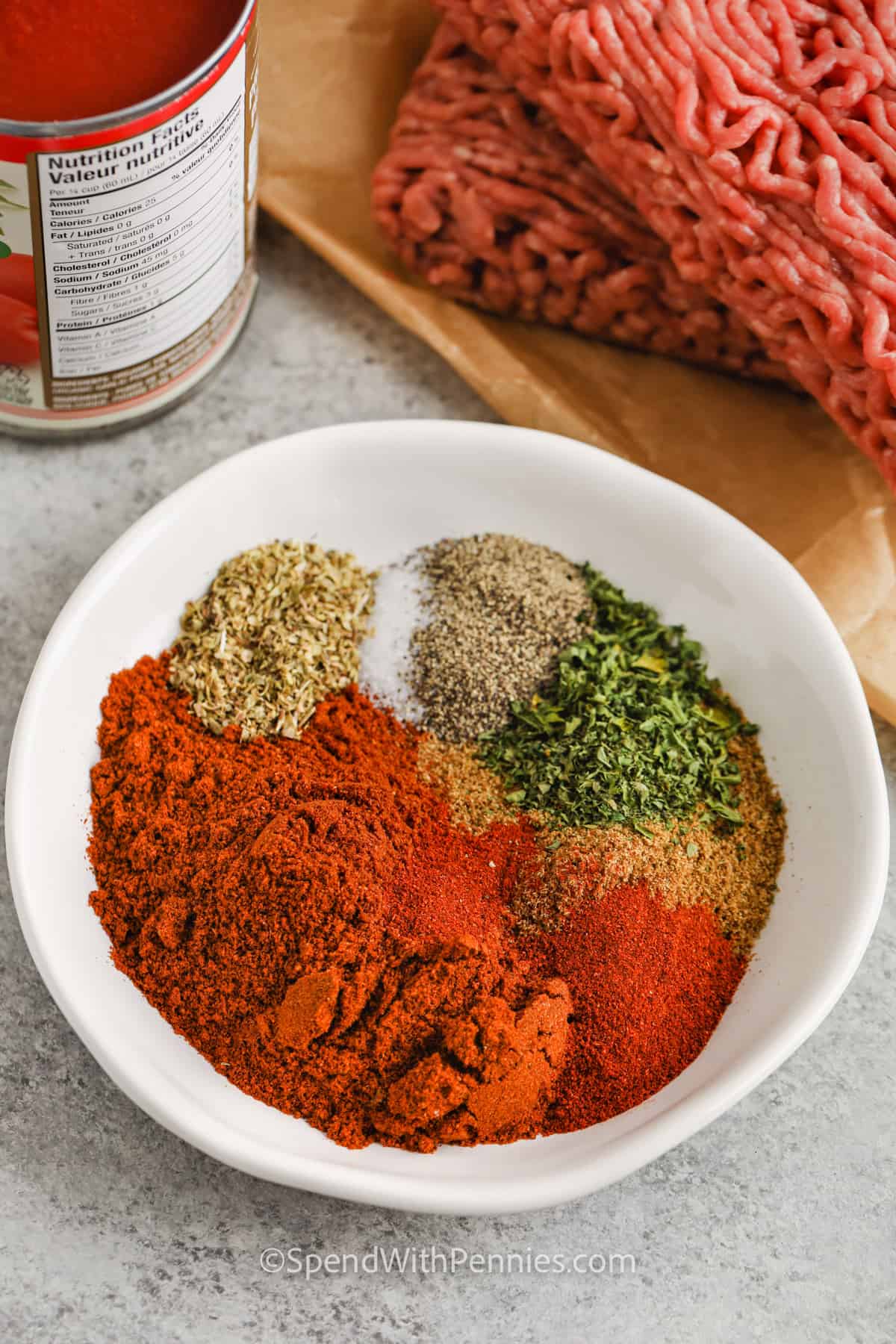 Easy crockpot chili is a one-pot wonder full of bold chili flavor, hearty beef, and warming spices. With just 20 minutes of prep, this hands-off slow cooker meal is perfect for busy schedules. The mix of chili powder, cumin, paprika, and oregano gives it that classic, crave-worthy taste, while kidney beans and tomatoes add extra flavor. Serve it with cornbread or over rice for a complete meal. #spendwithpennies seasonings in a bowl to make Easy Crock Pot Chili Recipe