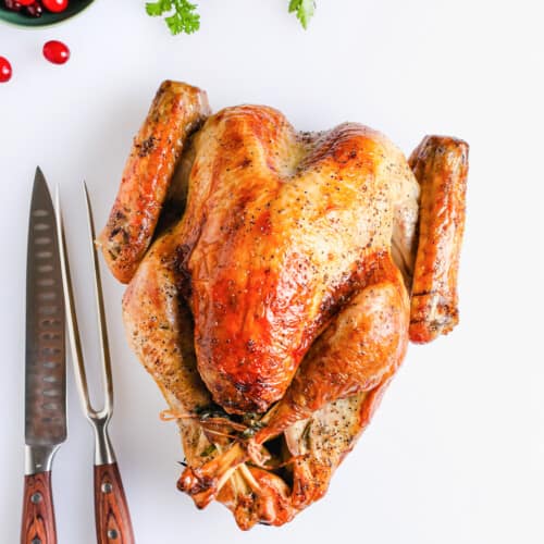 cooked turkey with carving tools