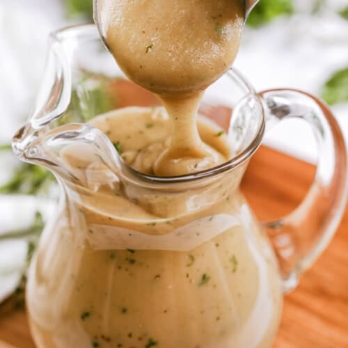 gravy being poured into a dish from a ladle for How to Make Gravy
