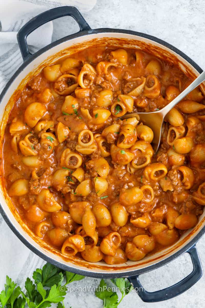 pot of cooked Hamburger Helper with a spoon