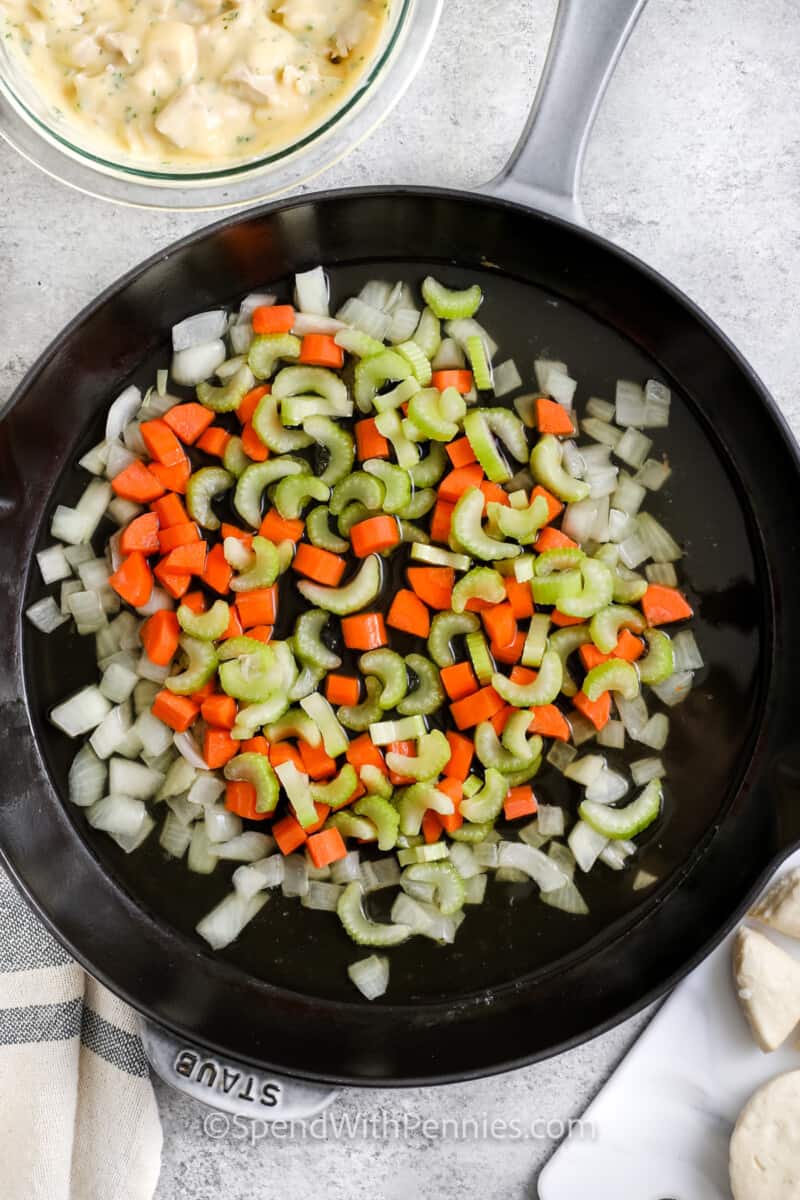 cooking celery and carrots to make Chicken and Biscuits