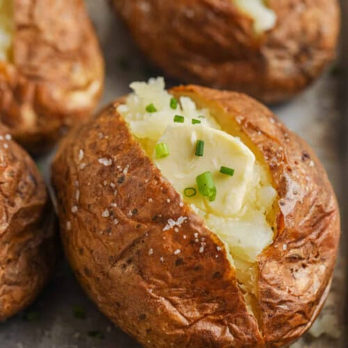 Close up of baked potatoes with butter